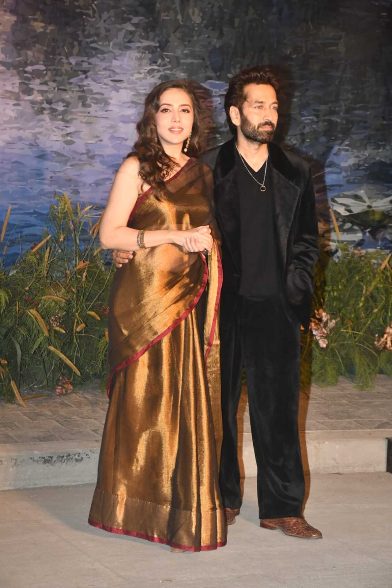 Nakuul Mehta and Jankee Parekh made a stylish appearance at the event. Jankee looked elegant in a brown and gold saree that added a traditional yet glamorous touch to her look. Nakuul complemented her in a sharp black formal outfit.
